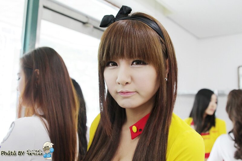 woman in yellow shirt with bow