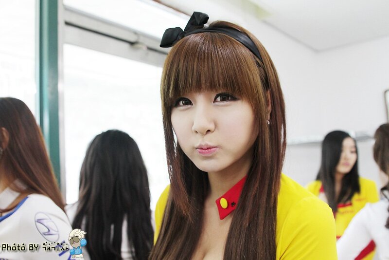 woman in yellow shirt with bow