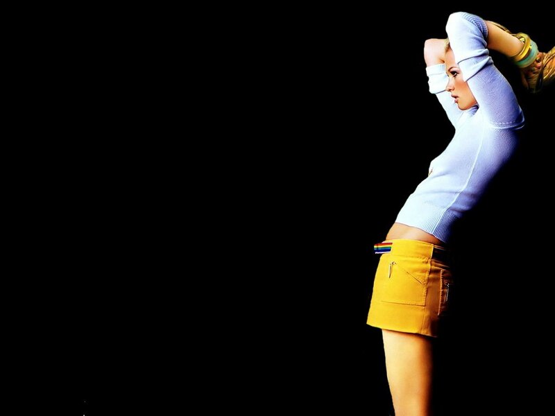 woman in yellow skirt posing