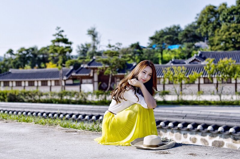 Woman in Yellow Skirt — Serene, Afternoon, Photograph, Hat