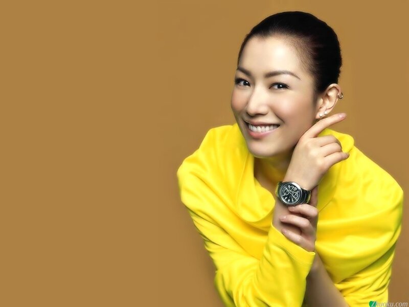 woman in yellow smiling