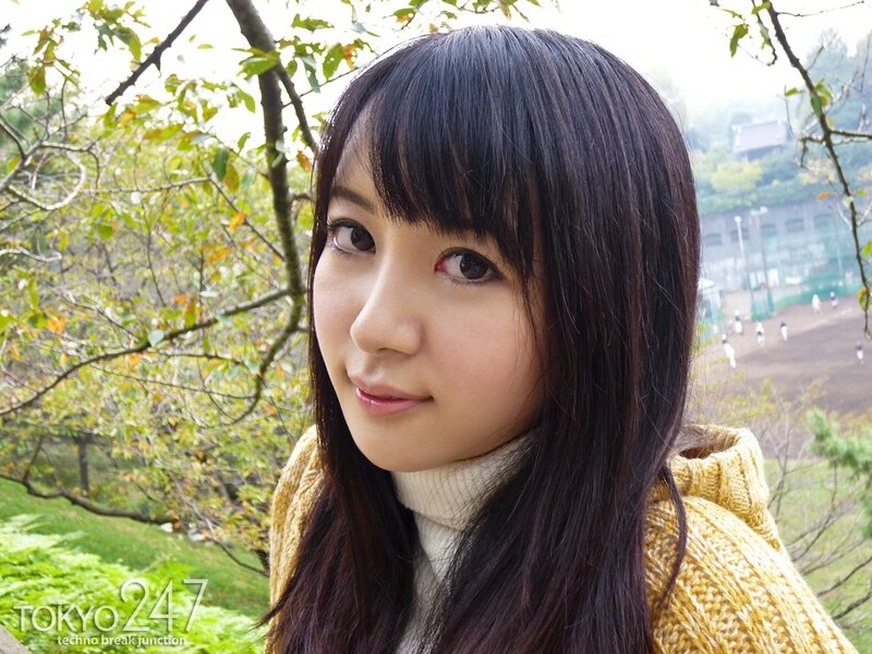 woman in yellow sweater outdoors
