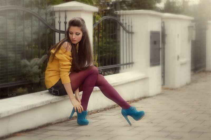 woman in yellow sweater sitting