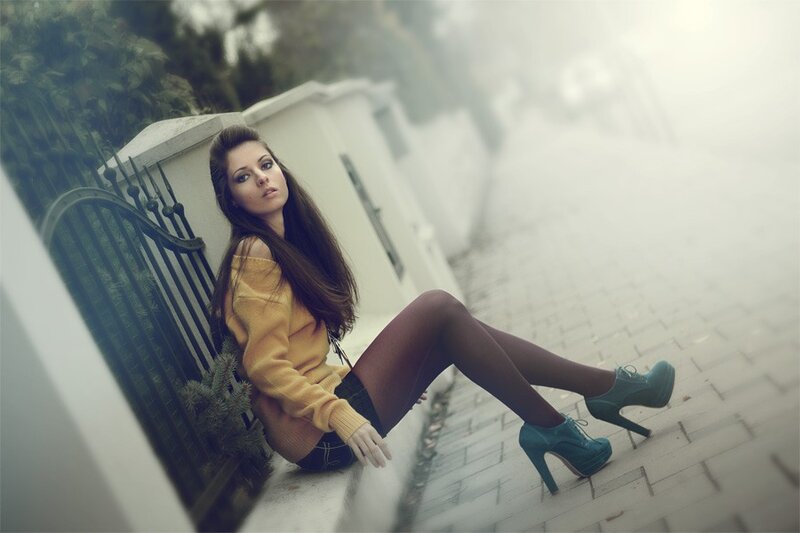woman in yellow sweater sitting