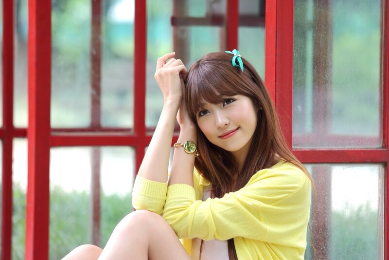 woman in yellow sweater smiling