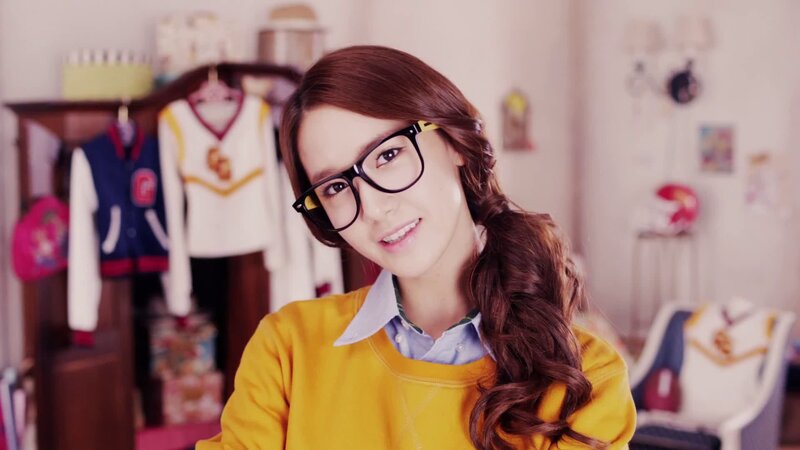 woman in yellow sweater smiling