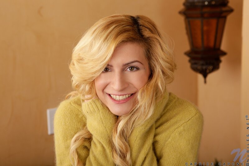 woman in yellow sweater smiling