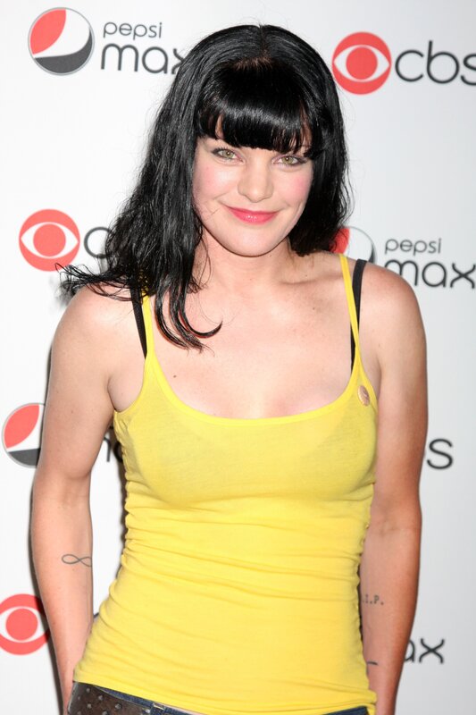 Woman in yellow top at event
