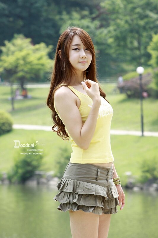 Woman in yellow top at park