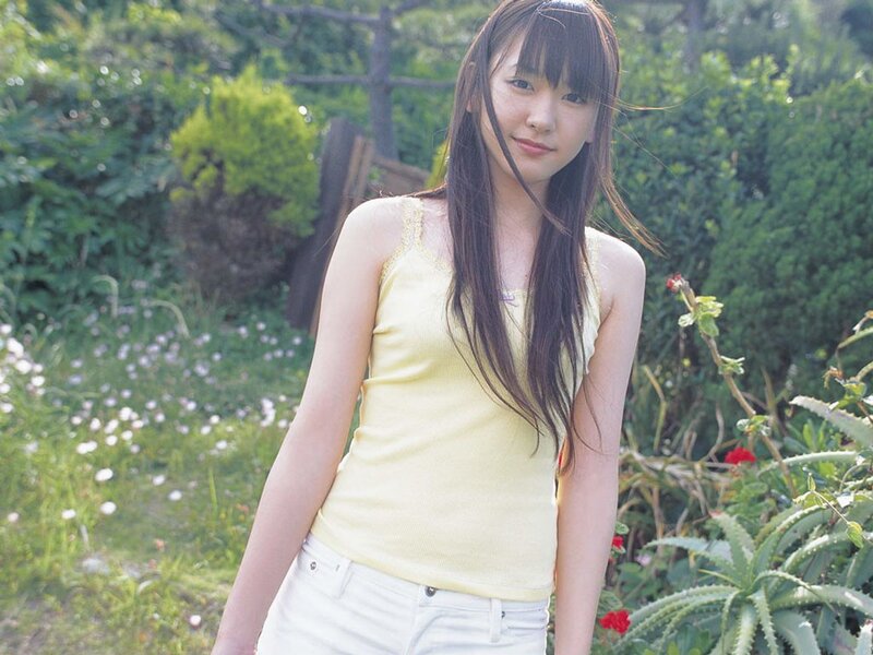 woman in yellow top outdoors