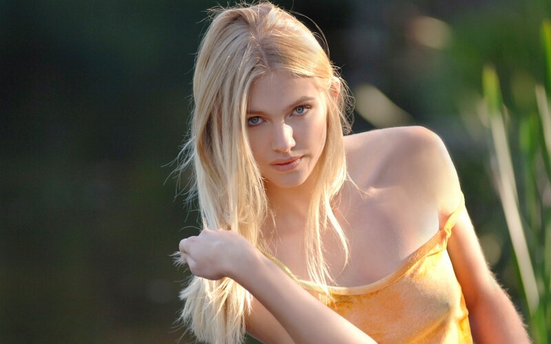 woman in yellow top outdoors