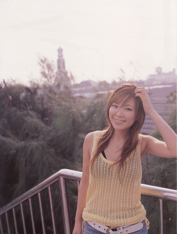 woman in yellow top smiling