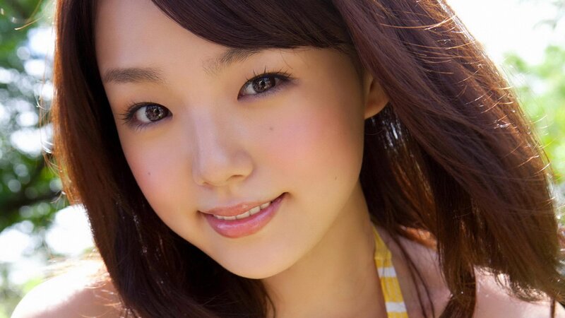 woman in yellow top smiling