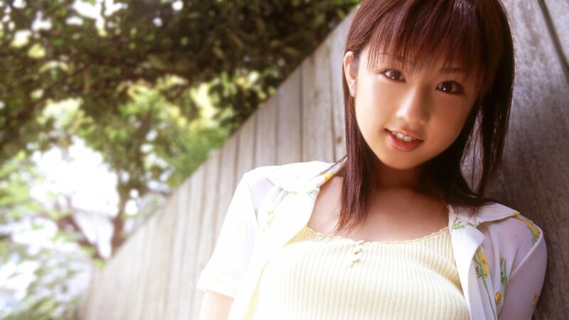 woman in yellow top smiling