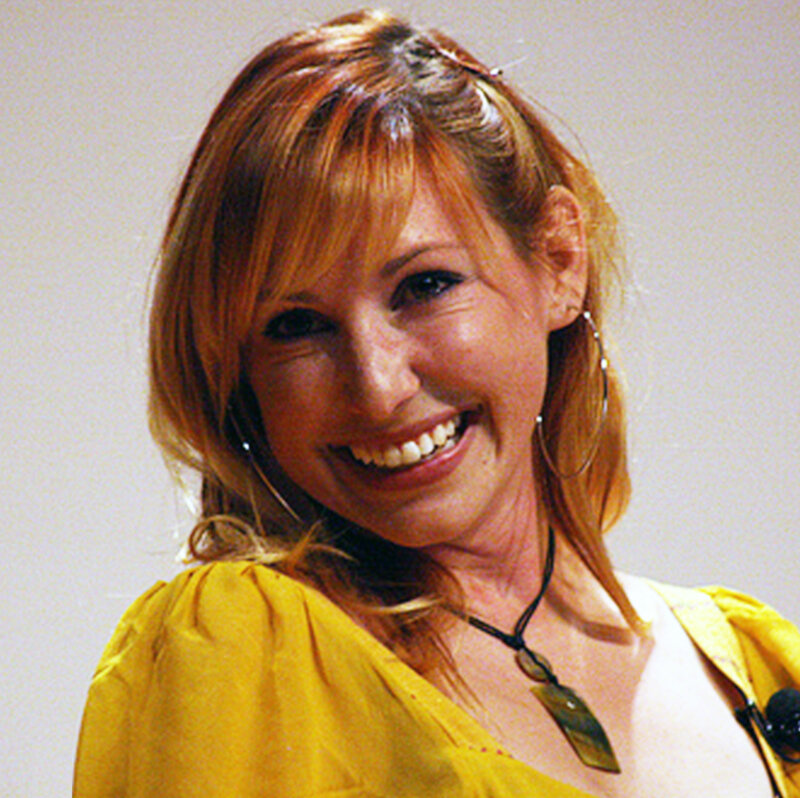 Woman in yellow top smiling