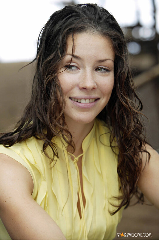 woman in yellow top smiling