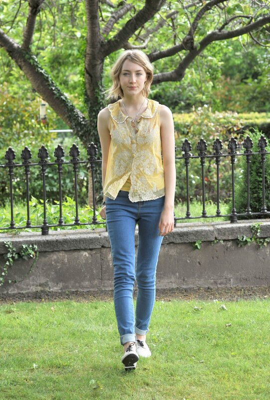 Woman in yellow top walking