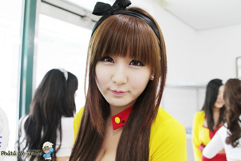 woman in yellow top with bow