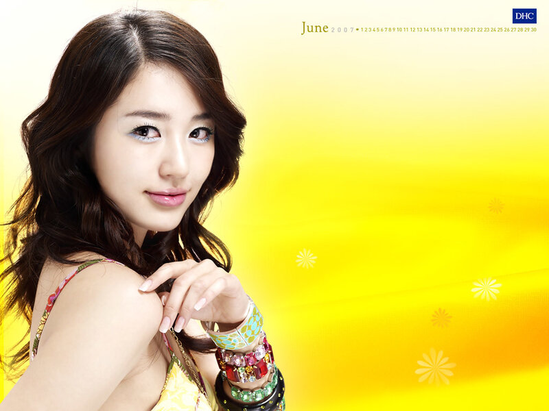 woman in yellow with bracelets