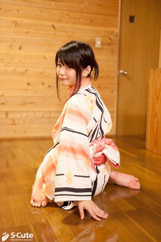 Woman in yukata sitting on floor