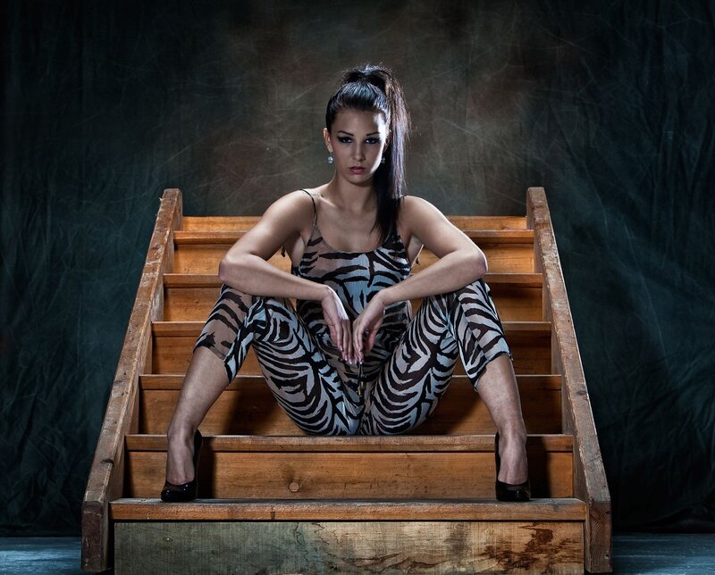 woman in zebra print on stairs