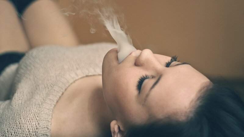 woman inhaling vapor
