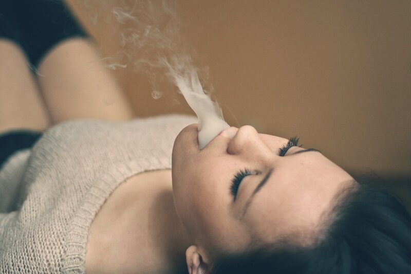 woman inhaling vapor