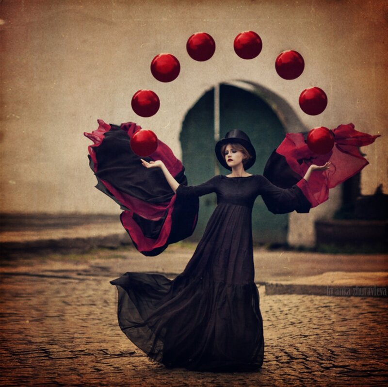 Woman Juggling Red Balls
