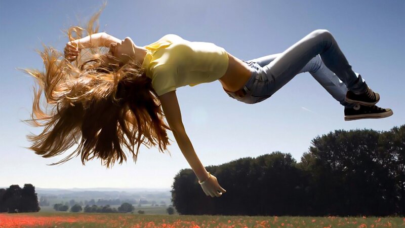Woman jumping in a field