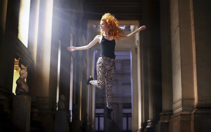 woman jumping in a hall