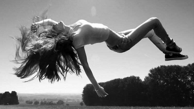 woman jumping in air
