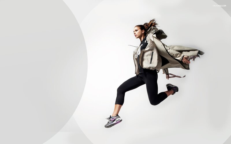 woman jumping in athletic wear