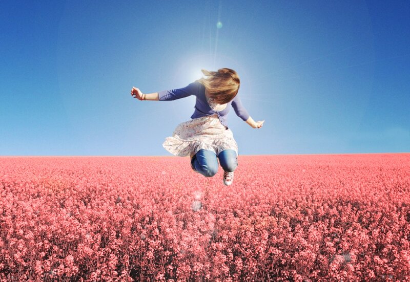 Woman Jumping in Field — Blue, Joyful
