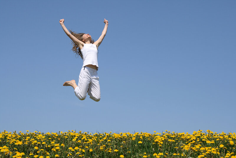 Woman Jumping in Field — Blue
