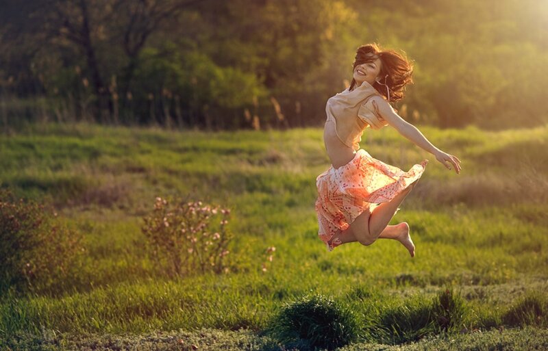 Woman Jumping in Field — Green, Joyful