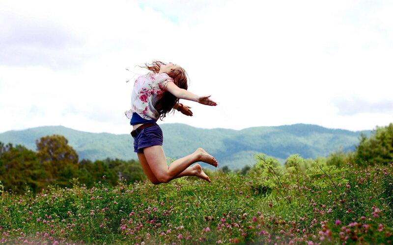 Woman Jumping in Field — Green