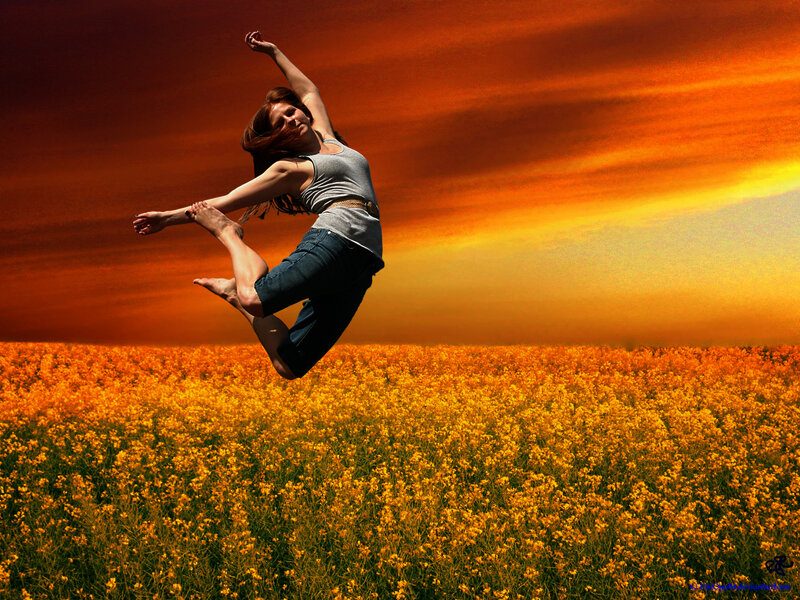 Woman Jumping in Field — Orange