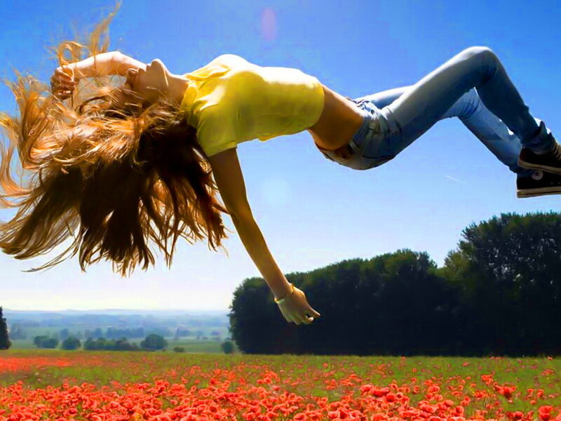 Woman Jumping in Field — Red