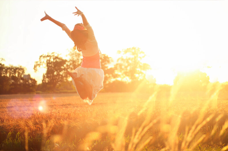 Woman Jumping in Field — Yellow, Bright
