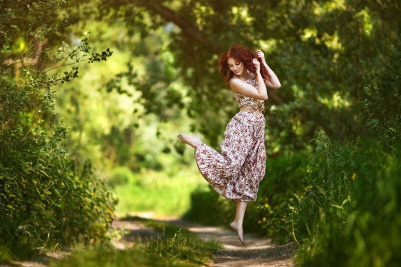 Woman Jumping in Forest