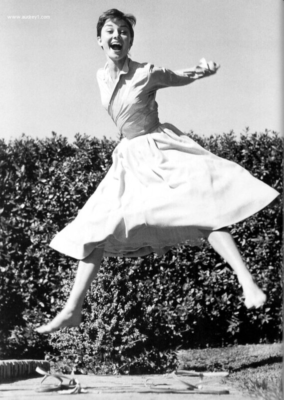 woman jumping in garden