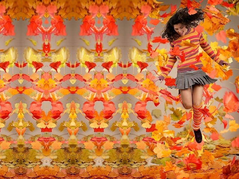 Woman Jumping in Leaves
