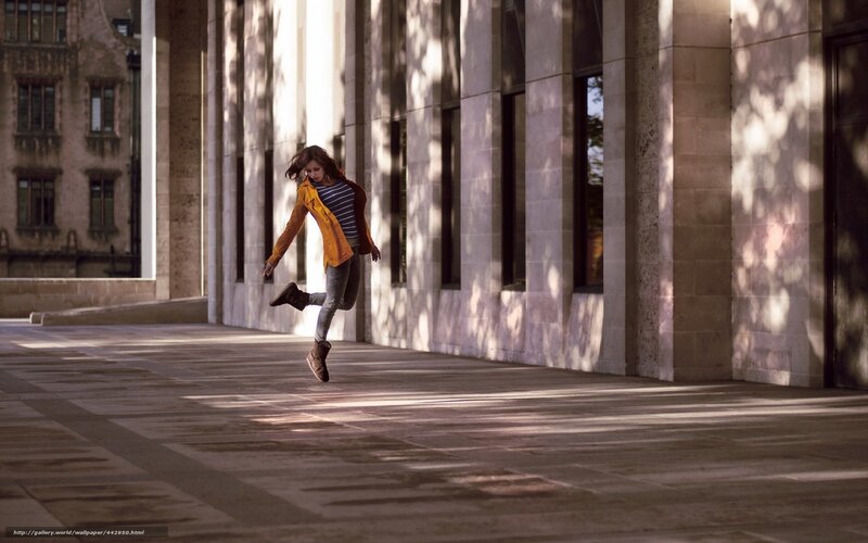 woman jumping in sunlight