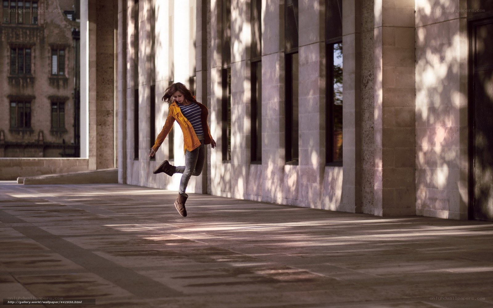 woman jumping in sunlight
