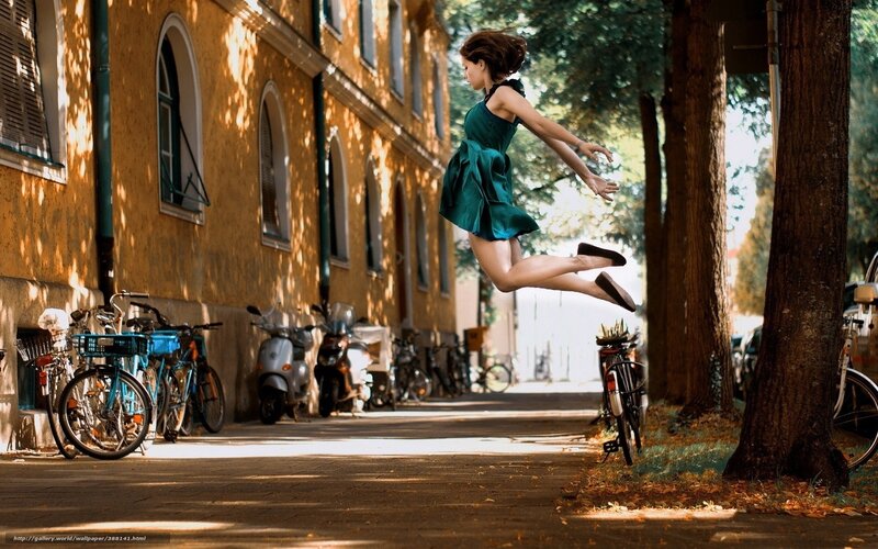 Woman jumping in the street