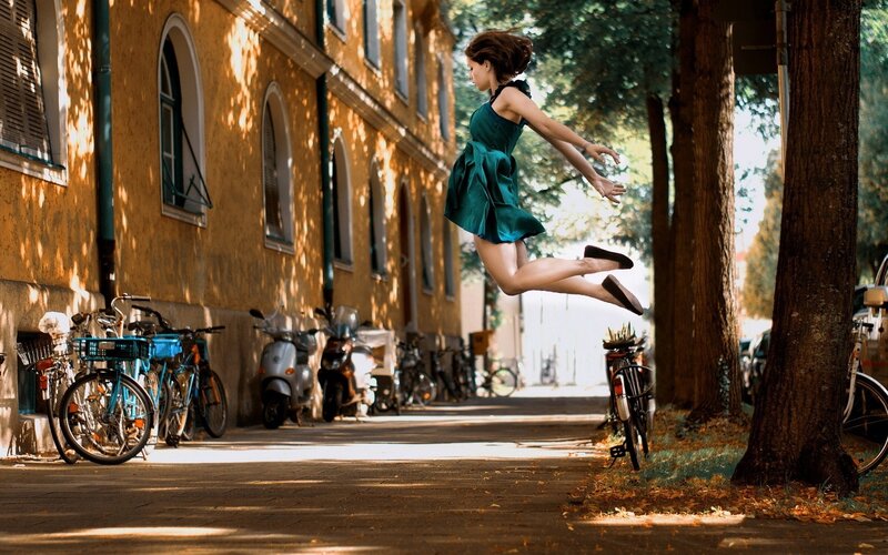 Woman jumping in the street
