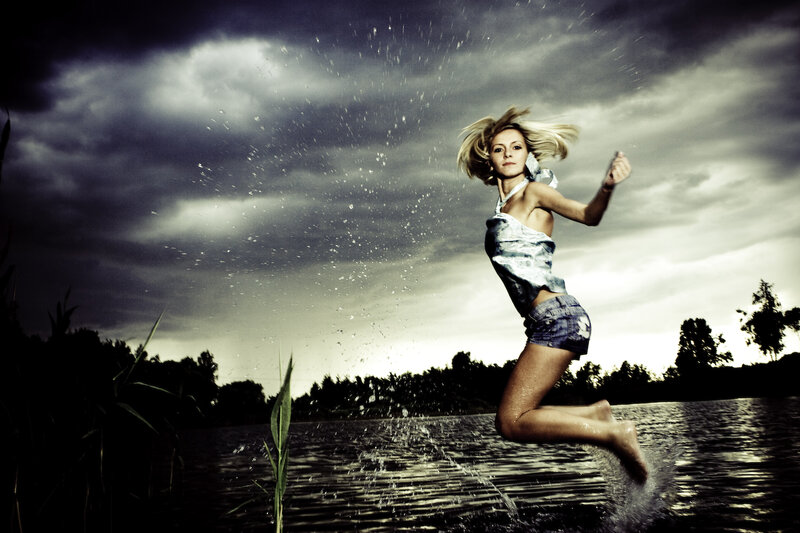 Woman Jumping in Water — Gray