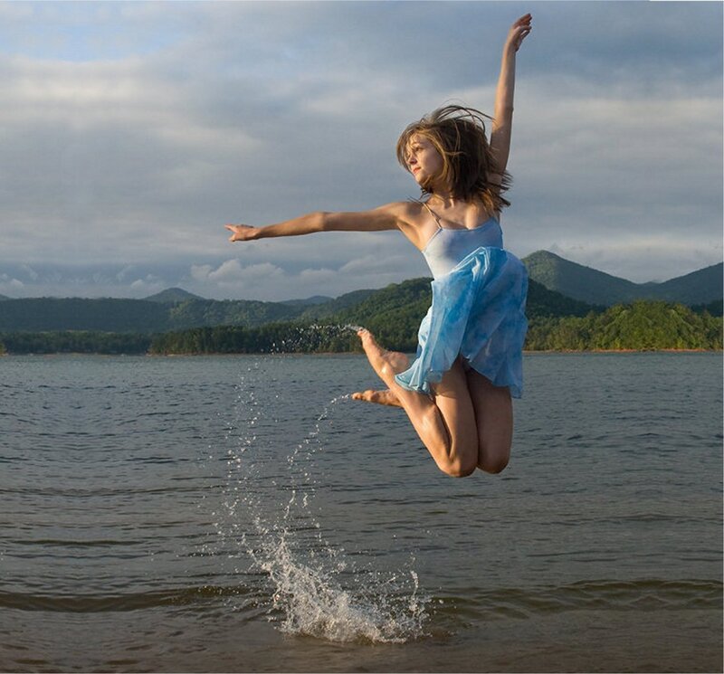 Woman Jumping in Water