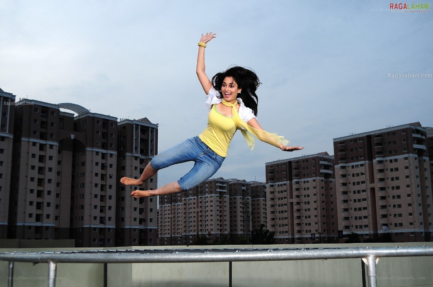 woman jumping on a rooftop
