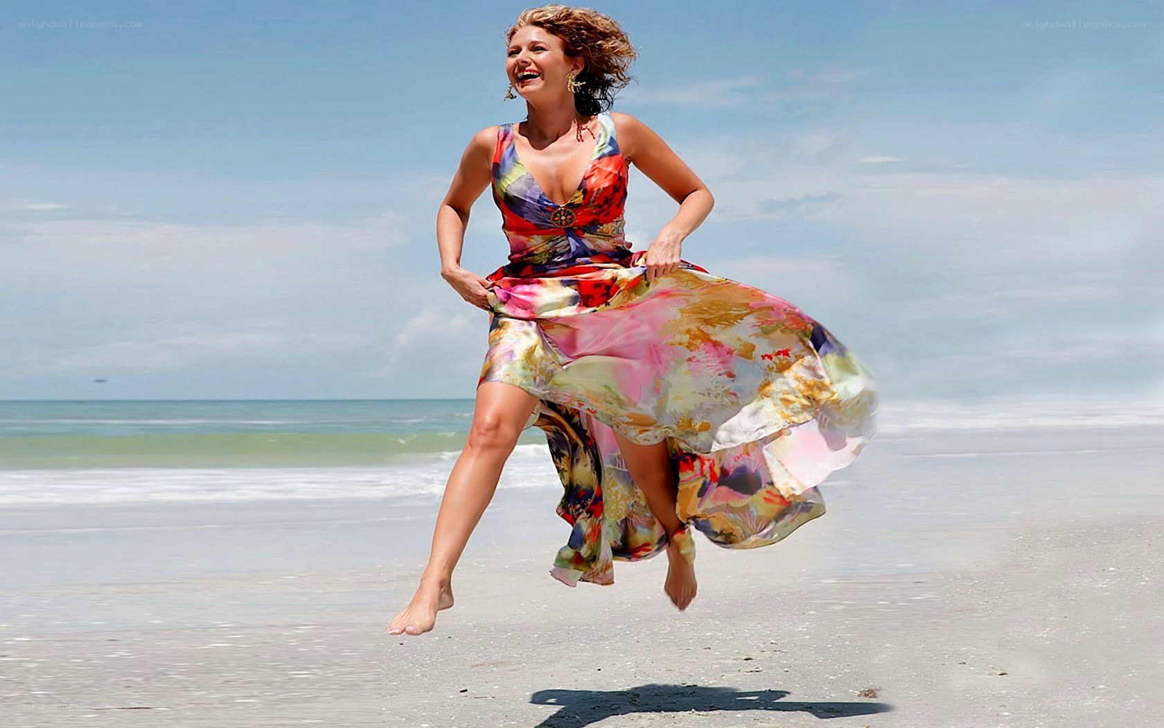 Woman jumping on beach